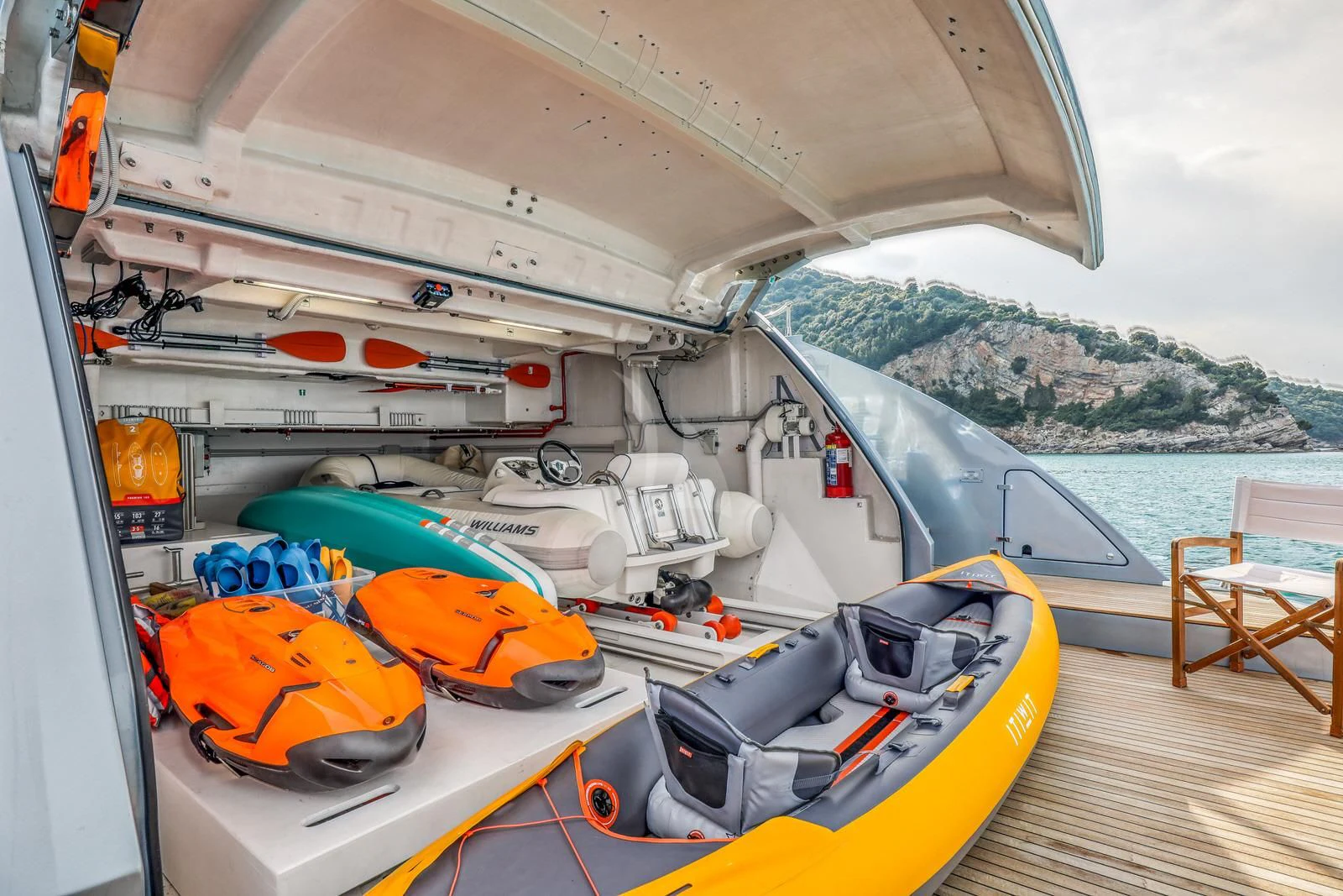 a boat with kayaks on it aboard 55 FIFTYFIVE Yacht for Charter