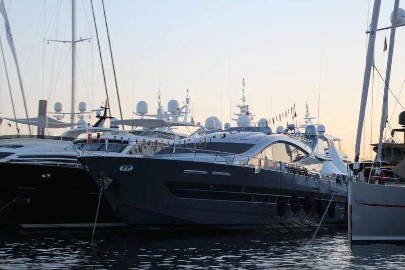a group of boats are parked in a harbor aboard 55 FIFTYFIVE Yacht for Charter