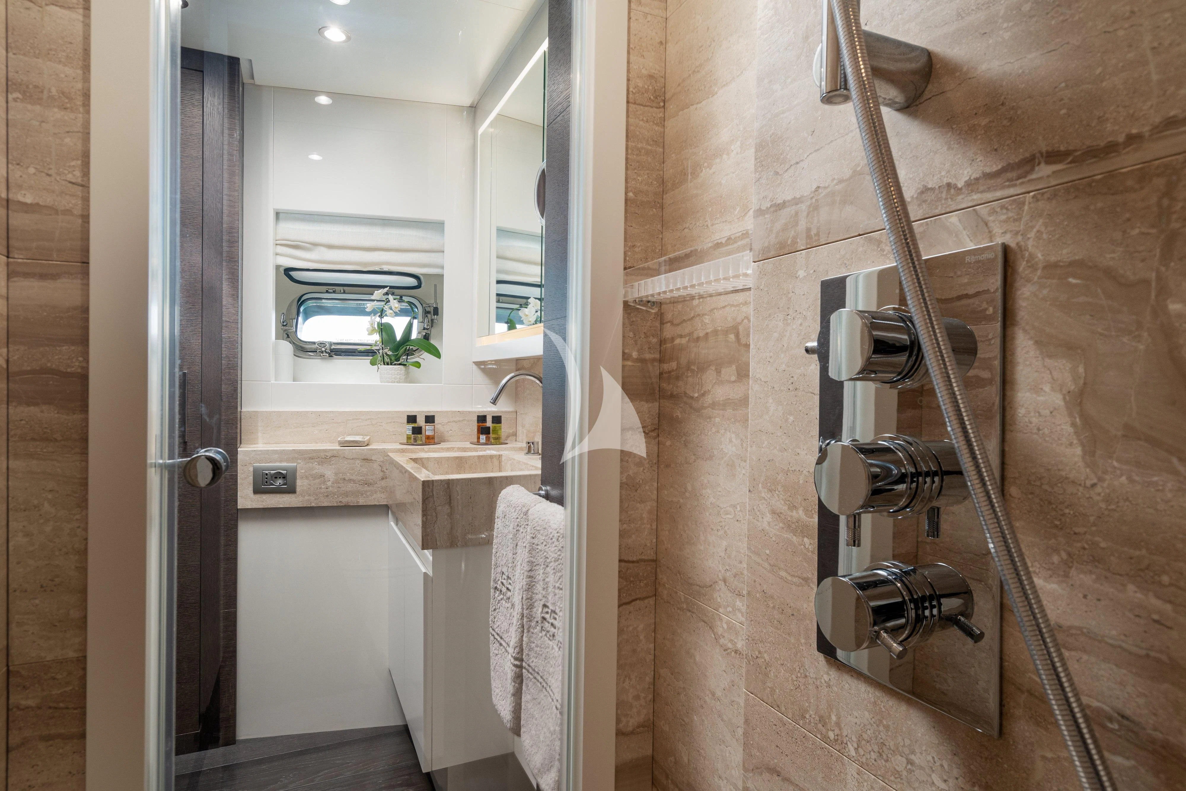 a bathroom with a glass shower aboard 55 FIFTYFIVE Yacht for Charter