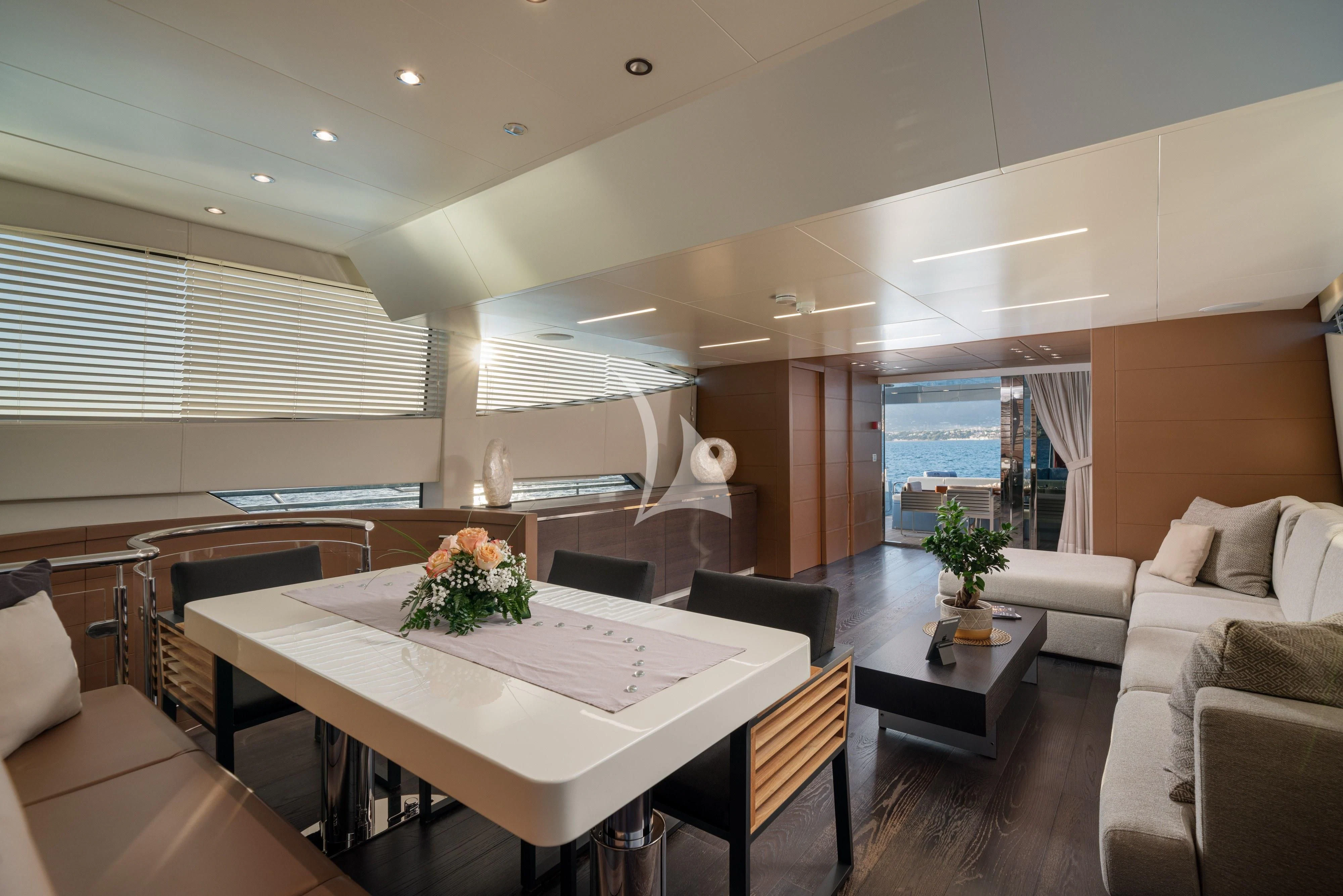 a room with a table chairs and a couch aboard 55 FIFTYFIVE Yacht for Charter
