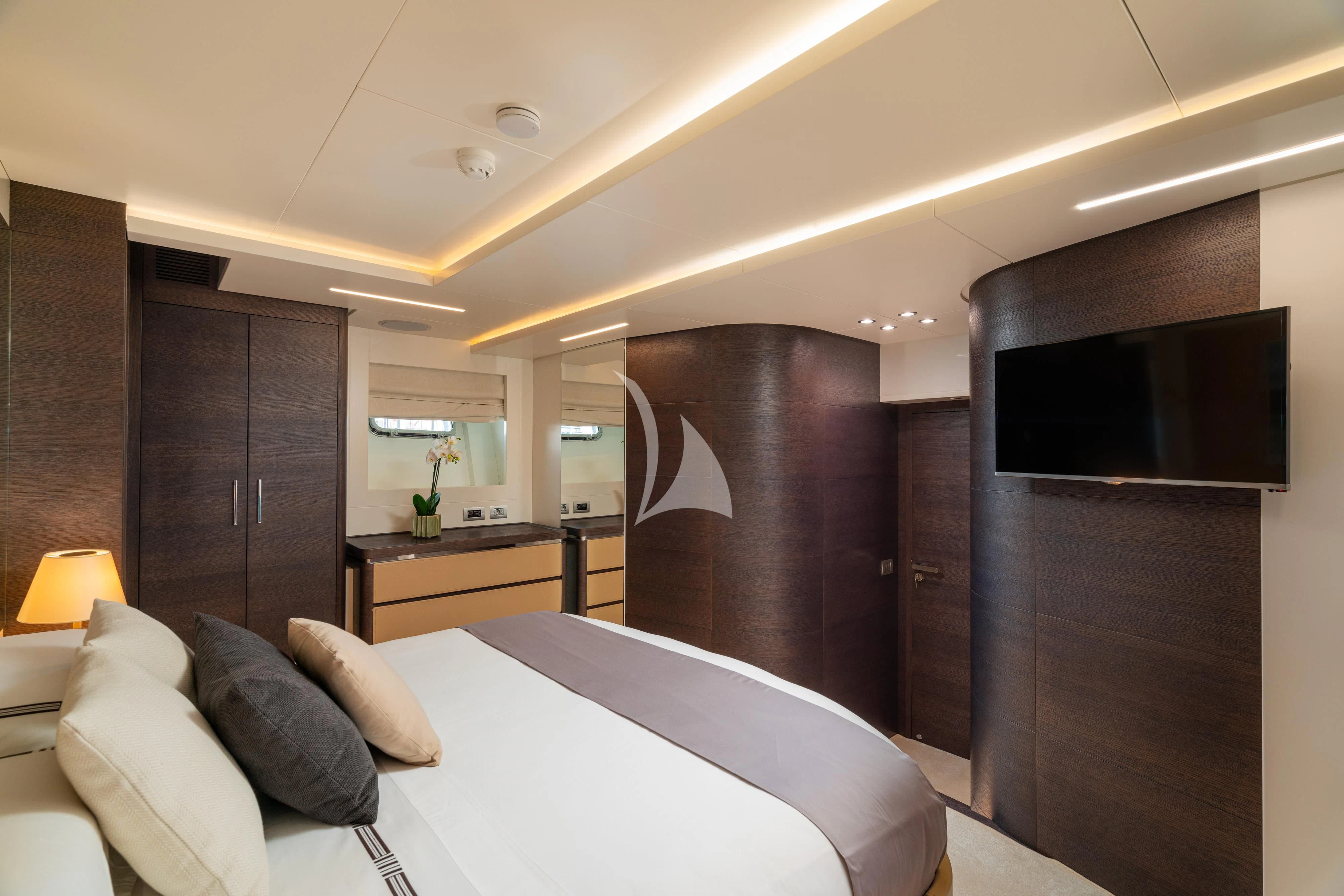 a bedroom with a bed and tv aboard 55 FIFTYFIVE Yacht for Charter