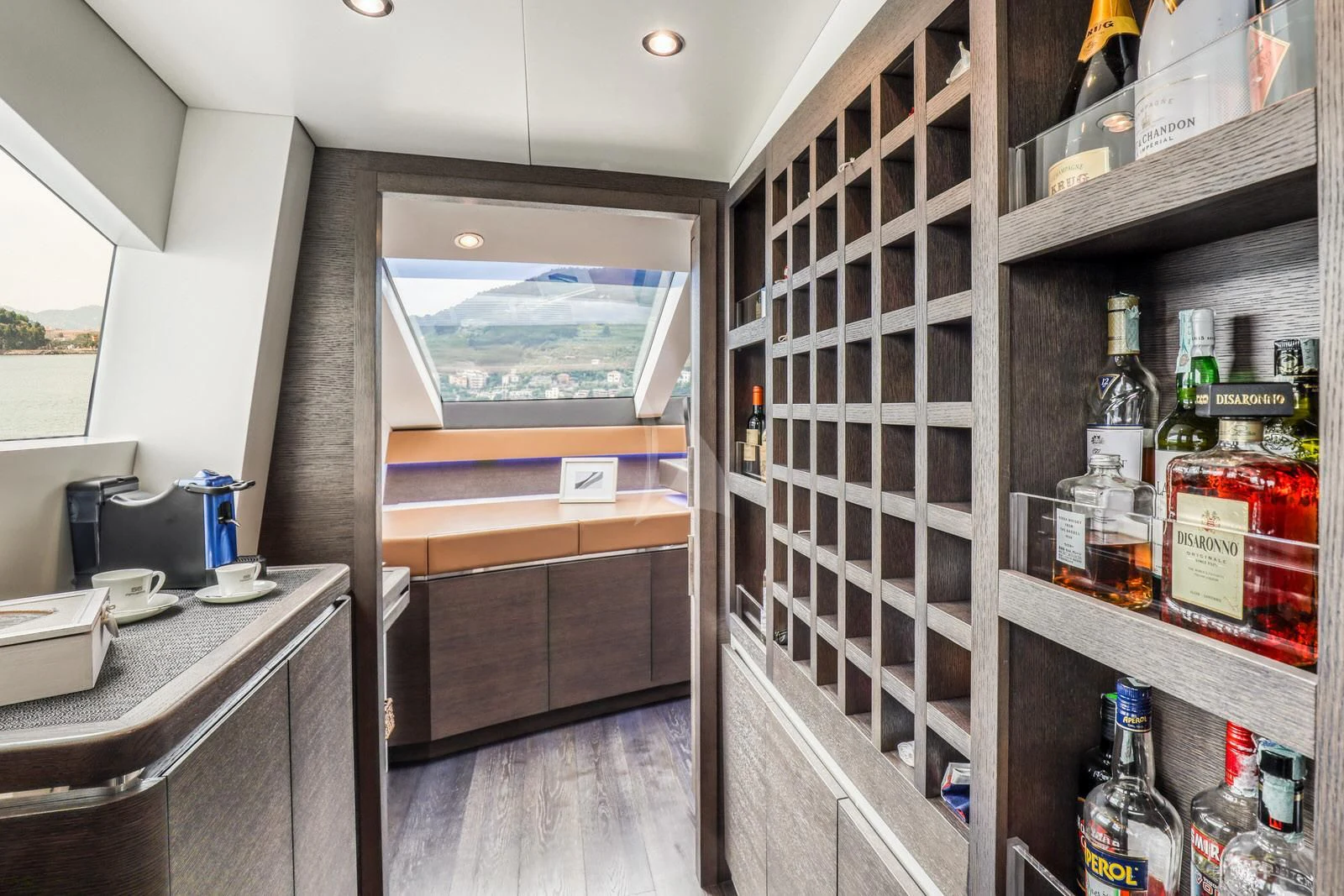 a room with shelves and bottles aboard 55 FIFTYFIVE Yacht for Charter
