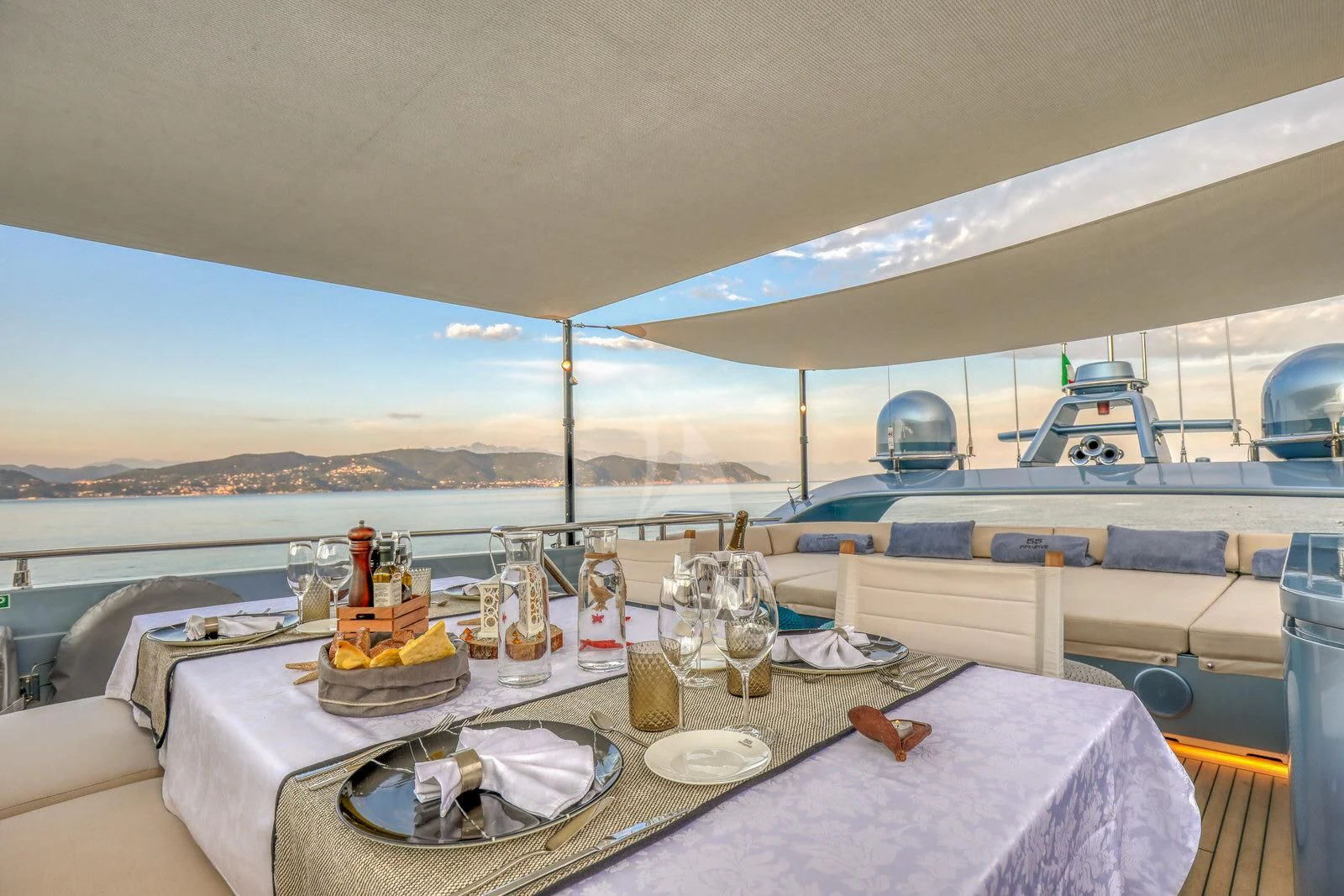 a table with food and drinks on it aboard 55 FIFTYFIVE Yacht for Charter