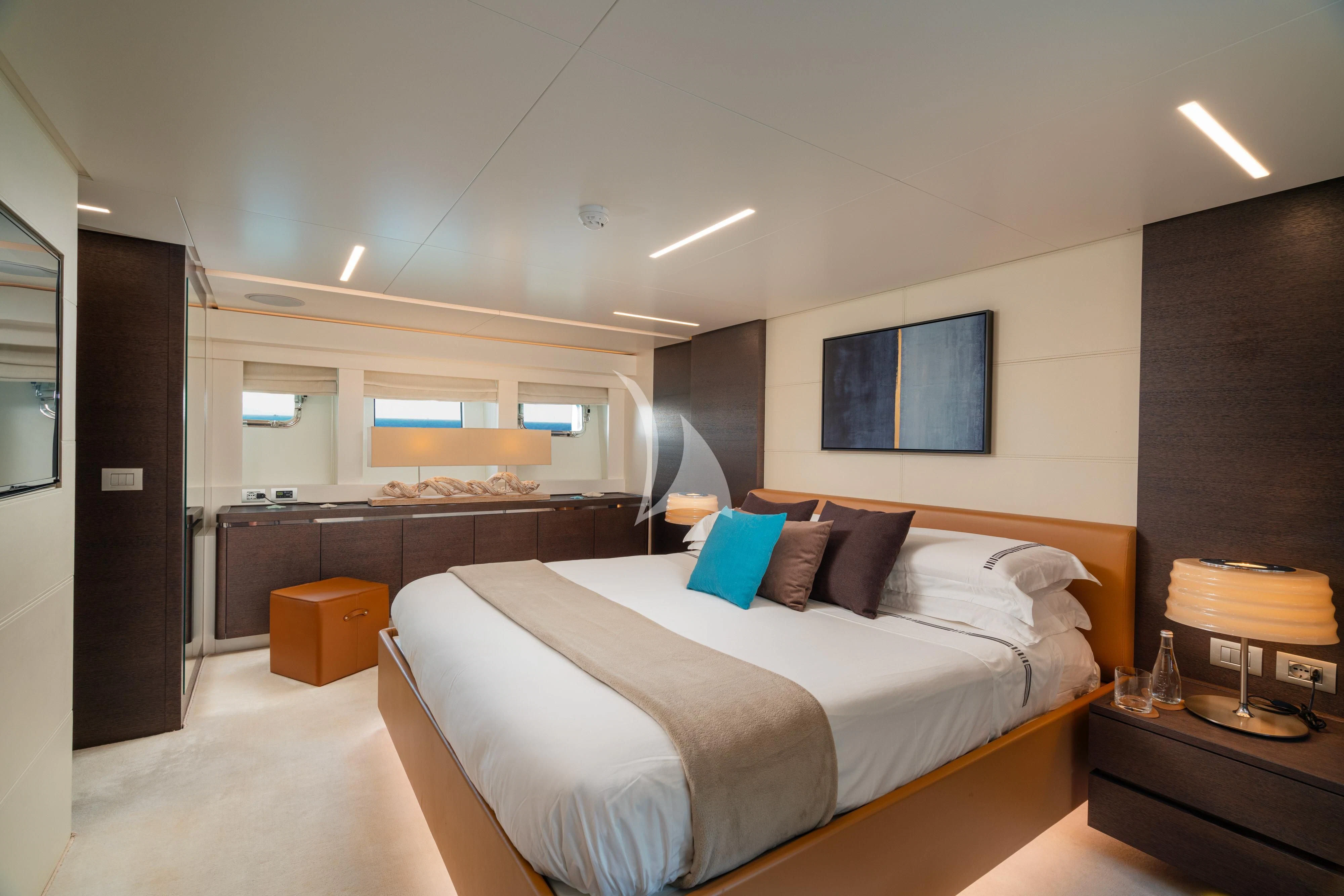 a bedroom with a bed and a desk aboard 55 FIFTYFIVE Yacht for Charter