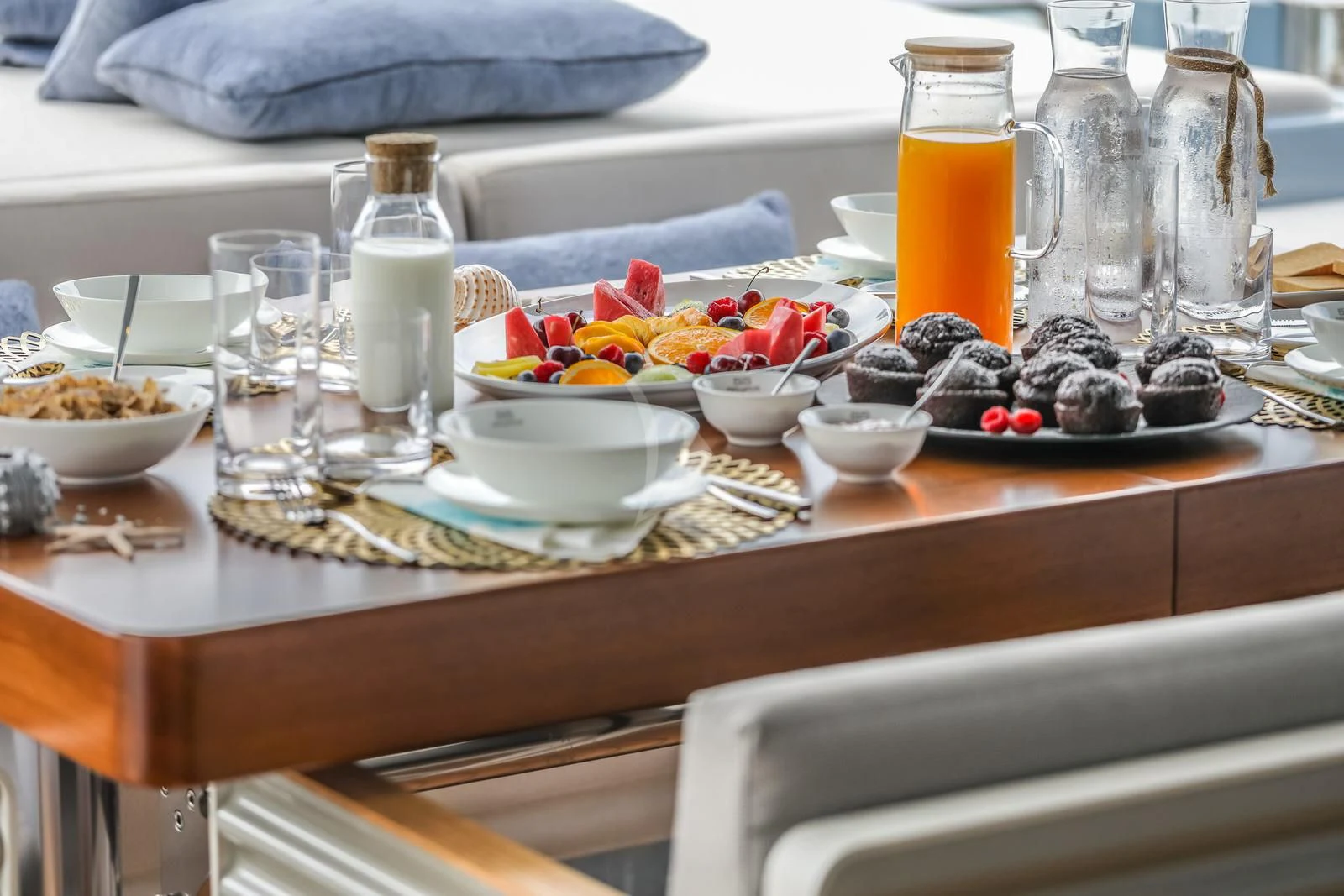 a table with food and drinks on it aboard 55 FIFTYFIVE Yacht for Charter