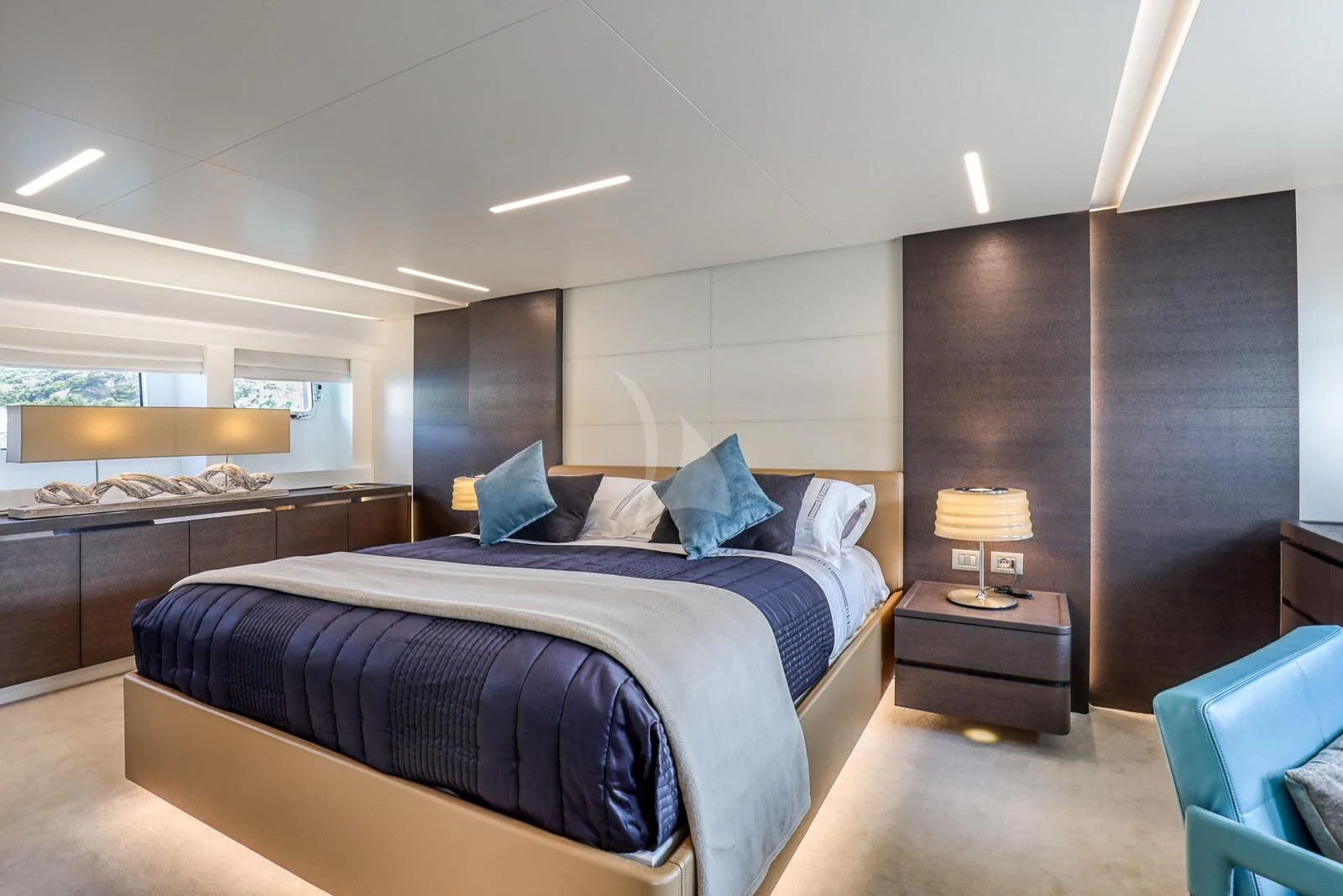a bedroom with a bed and a desk aboard 55 FIFTYFIVE Yacht for Charter