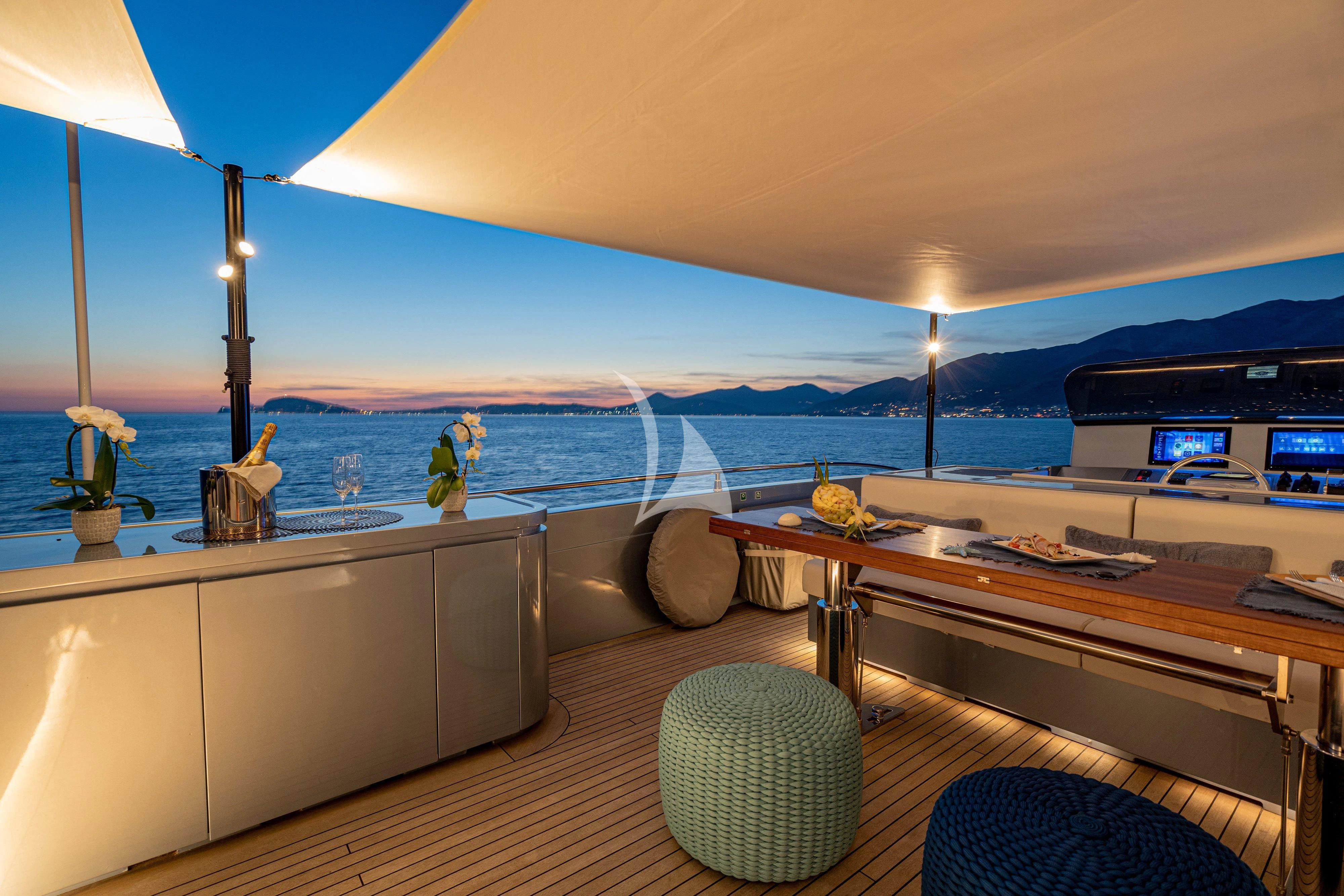 a room with a view of the ocean and a large pool aboard 55 FIFTYFIVE Yacht for Charter