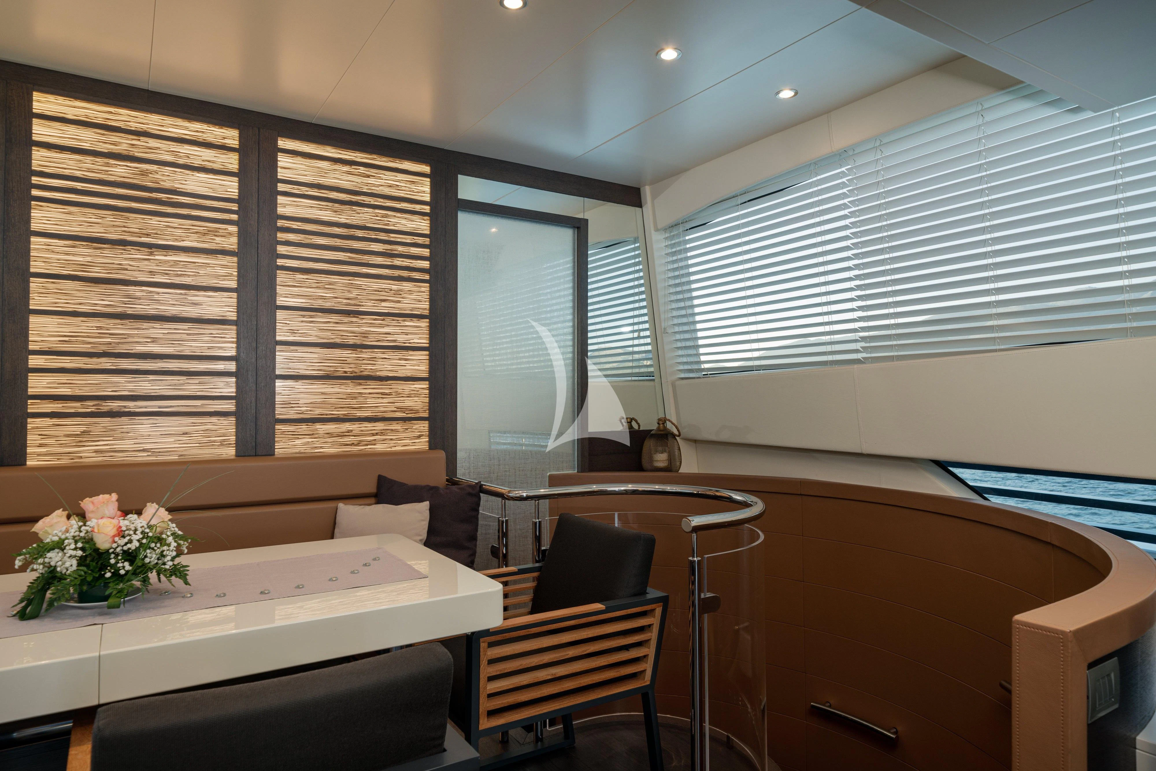 a room with a table and chairs aboard 55 FIFTYFIVE Yacht for Charter