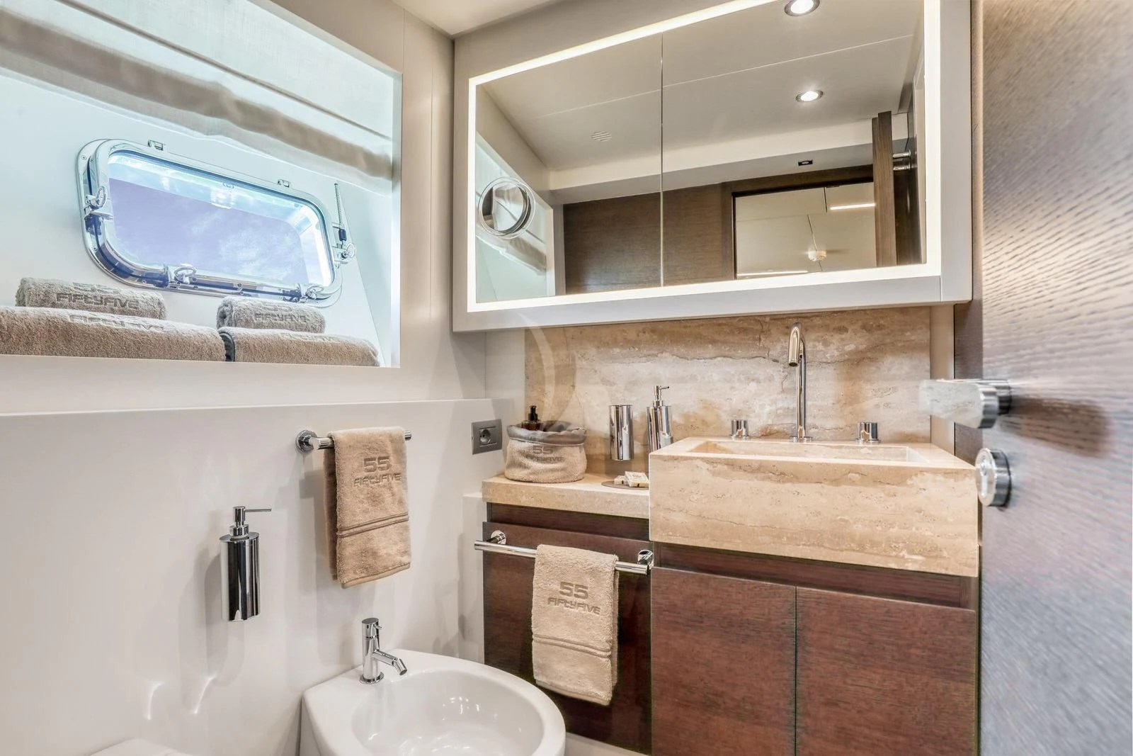 a bathroom with a sink and a mirror aboard 55 FIFTYFIVE Yacht for Charter