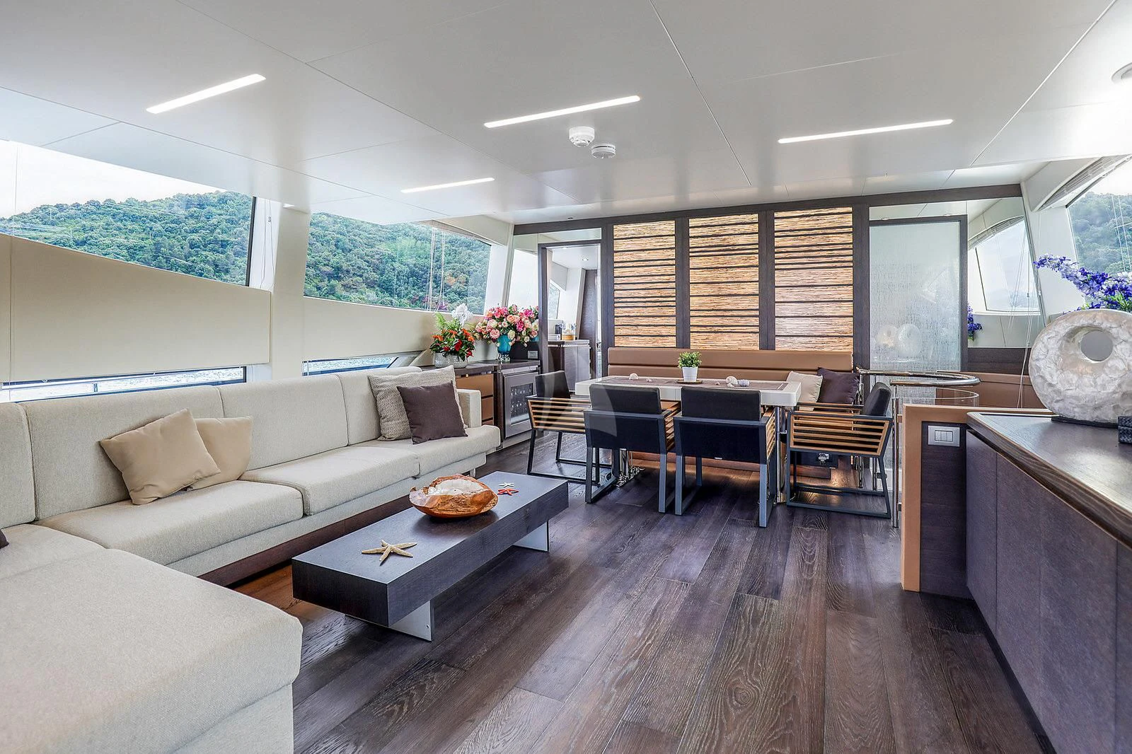 a living room with a couch and a table aboard 55 FIFTYFIVE Yacht for Charter