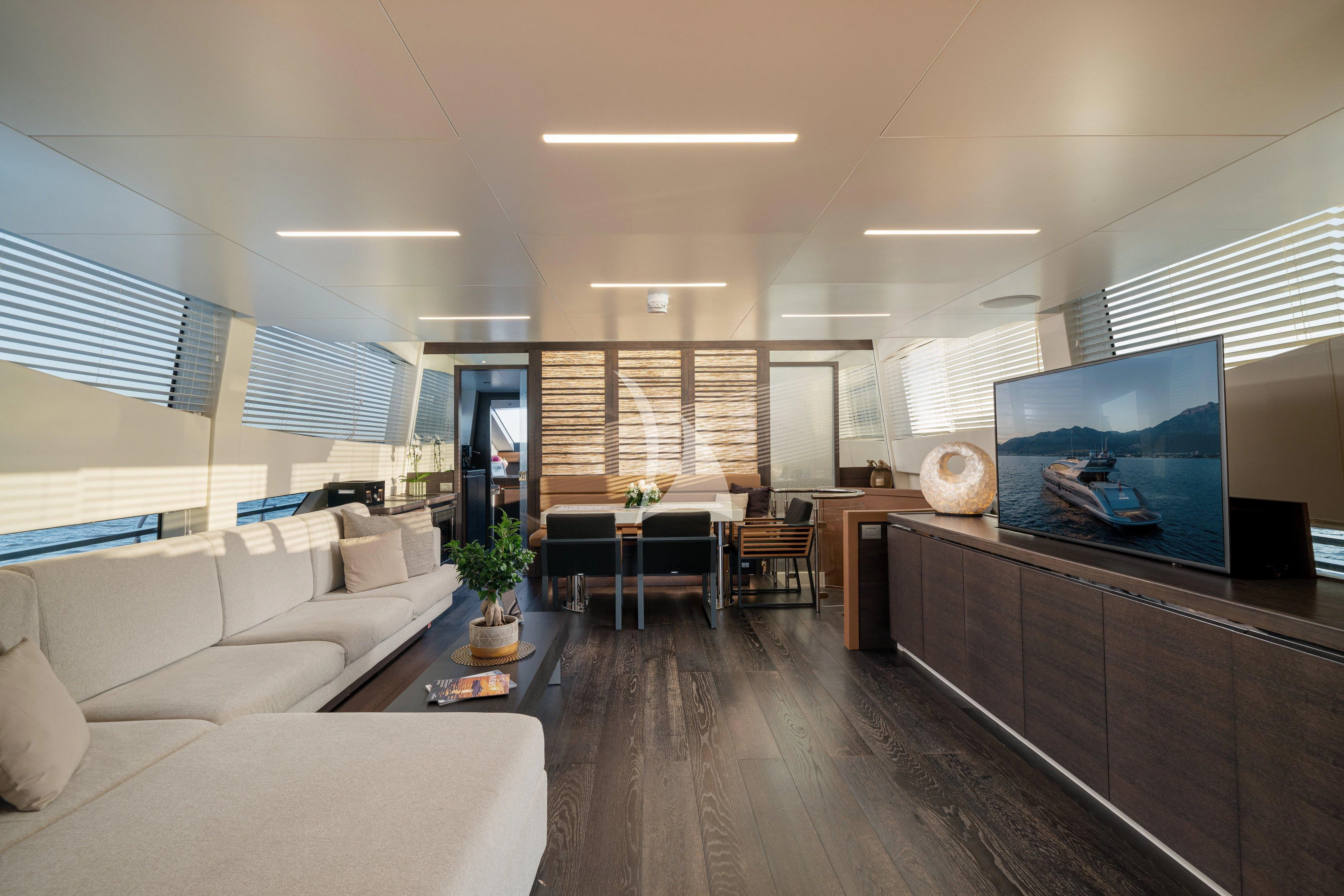 a living room with a wood floor aboard 55 FIFTYFIVE Yacht for Charter