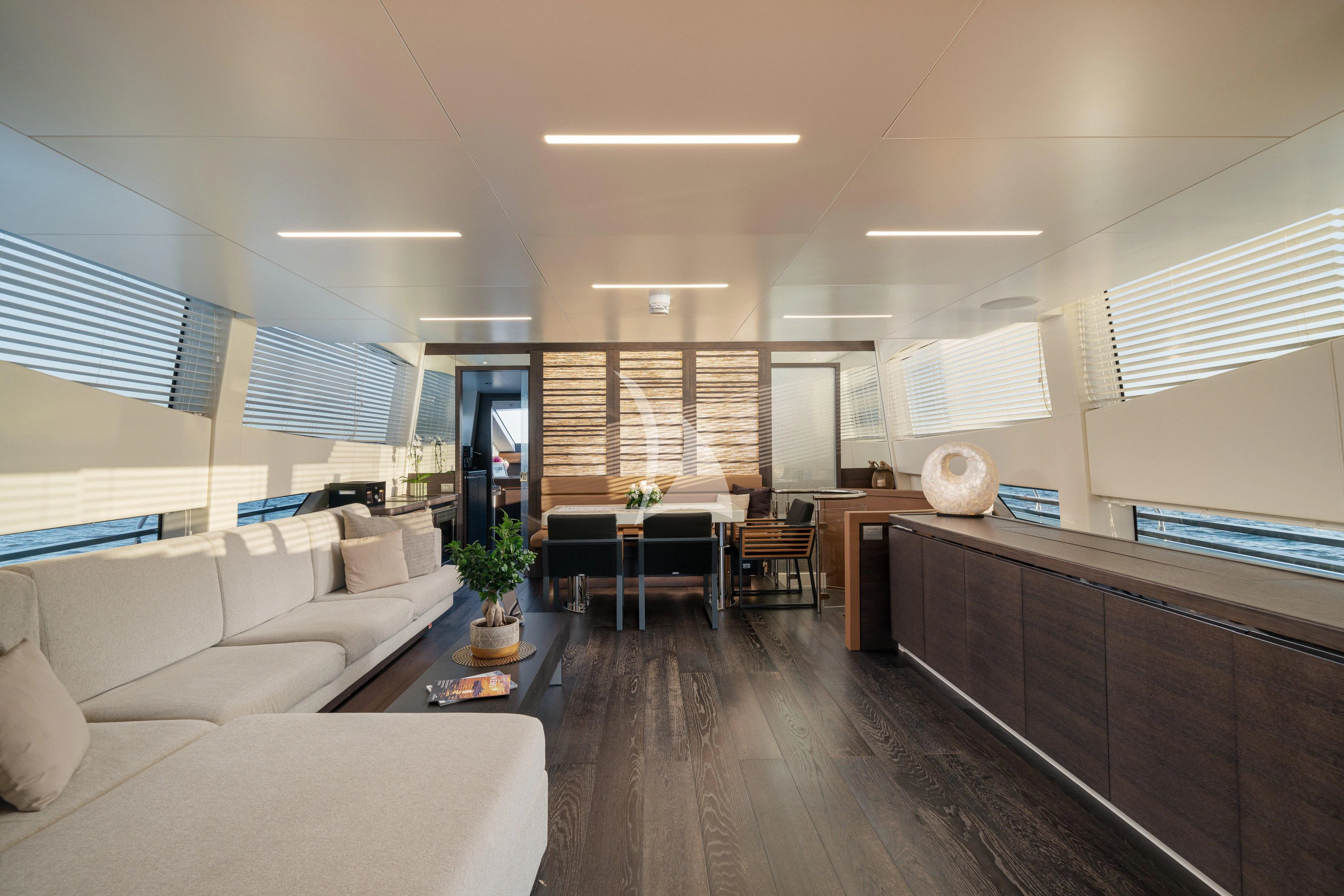 a living room with a wood floor aboard 55 FIFTYFIVE Yacht for Charter
