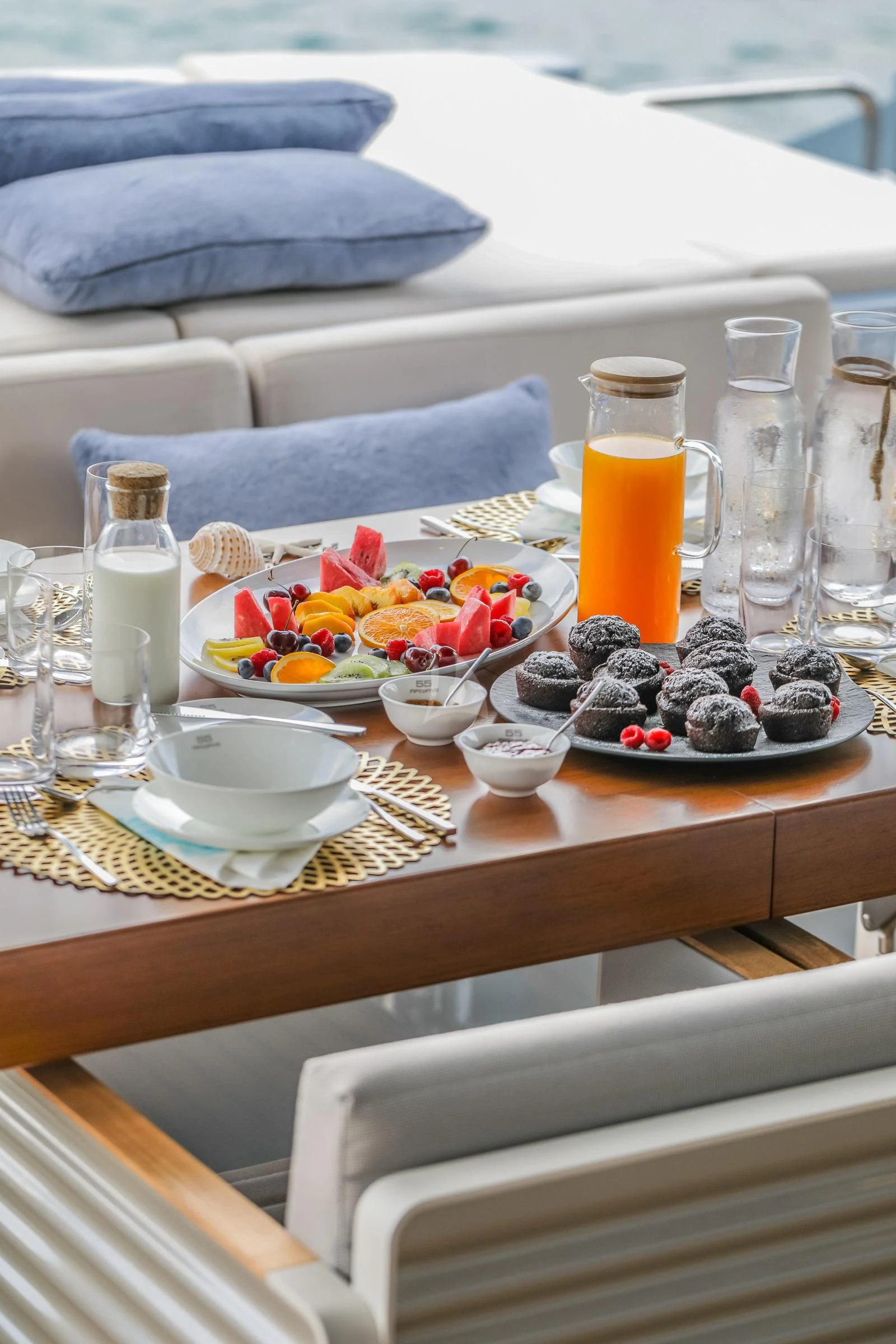 a table with food and drinks on it aboard 55 FIFTYFIVE Yacht for Charter