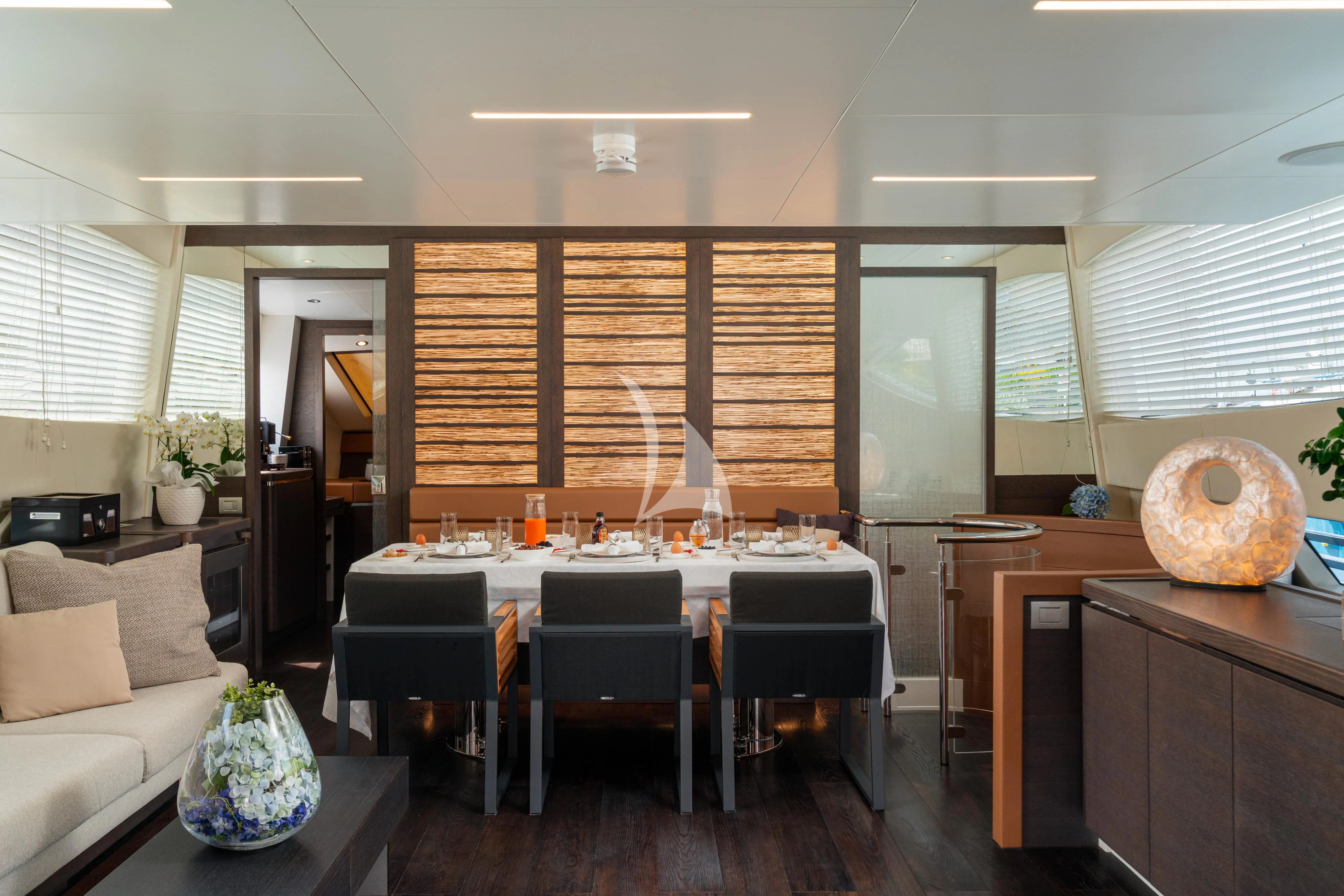 a room with a table and chairs aboard 55 FIFTYFIVE Yacht for Charter