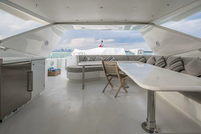a room with chairs and tables aboard AKIM Yacht for Sale