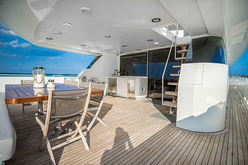 a room with a table and chairs aboard AKIM Yacht for Sale