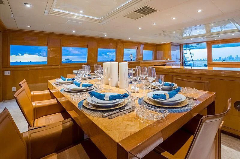 a table with plates and glasses on it aboard AKIM Yacht for Sale