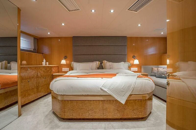 a room with a bed and a desk aboard AKIM Yacht for Sale