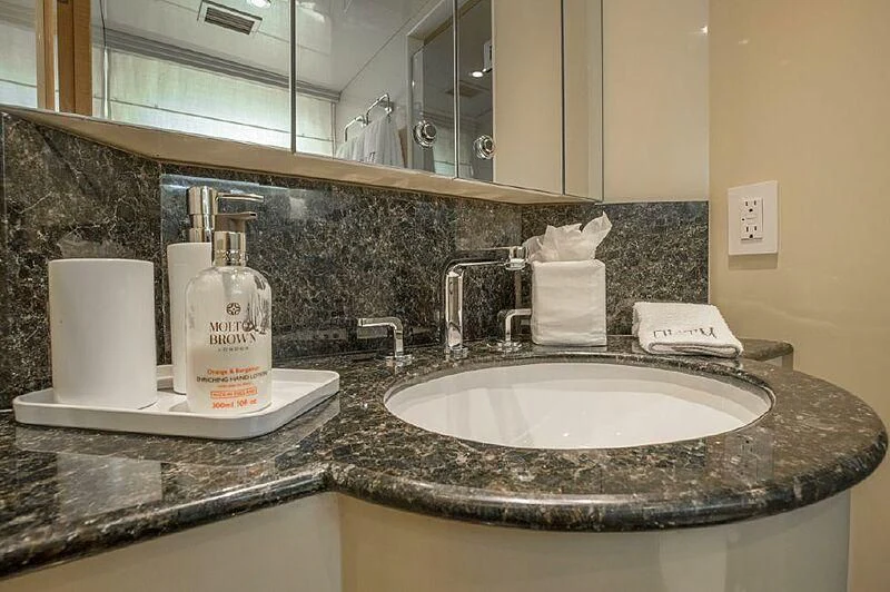 a bathroom sink with a mirror aboard AKIM Yacht for Sale