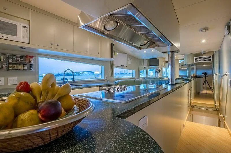 a large kitchen with a large glass ceiling aboard AKIM Yacht for Sale