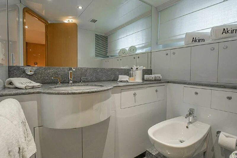 a bathroom with a large mirror aboard AKIM Yacht for Sale
