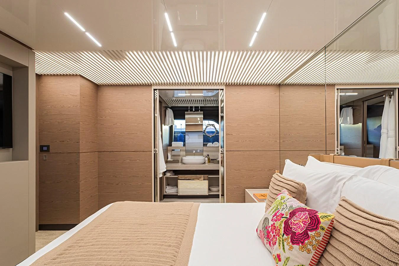 a room with a bed and a mirror aboard ANINHA 1 Yacht for Sale