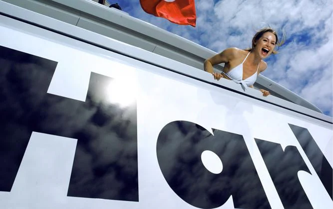 a person on a white and black staircase aboard HARLE Yacht for Sale