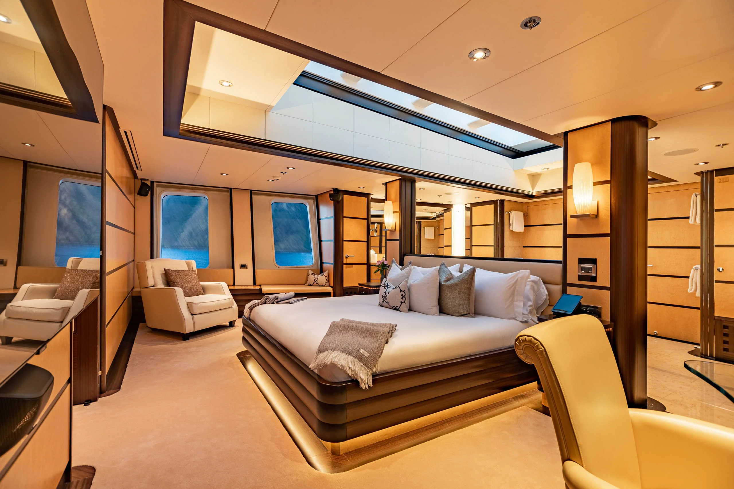 a room with a bed and a couch aboard HARLE Yacht for Sale