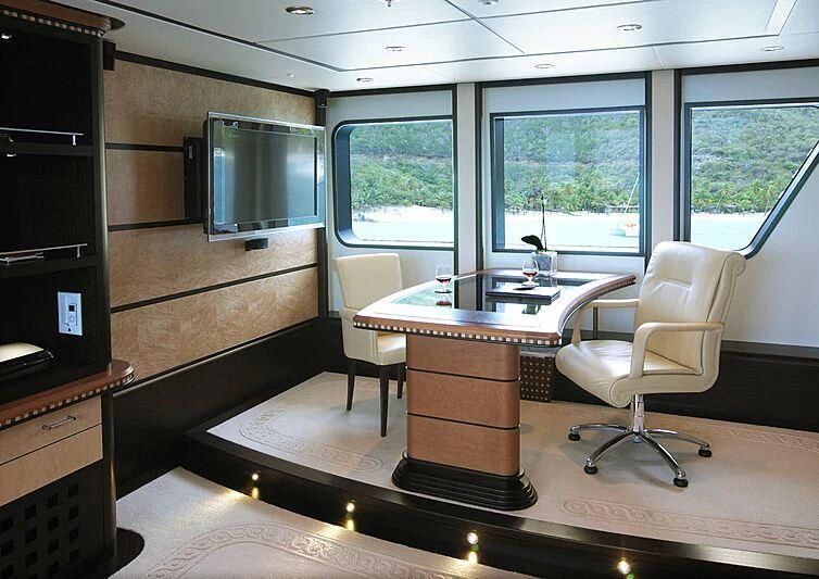 a room with a table and chairs aboard HARLE Yacht for Sale
