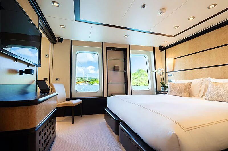 a room with a bed and a desk aboard HARLE Yacht for Sale