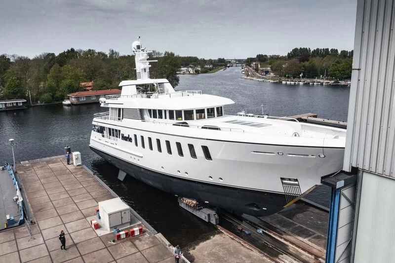 a large white boat docked aboard HARLE Yacht for Sale