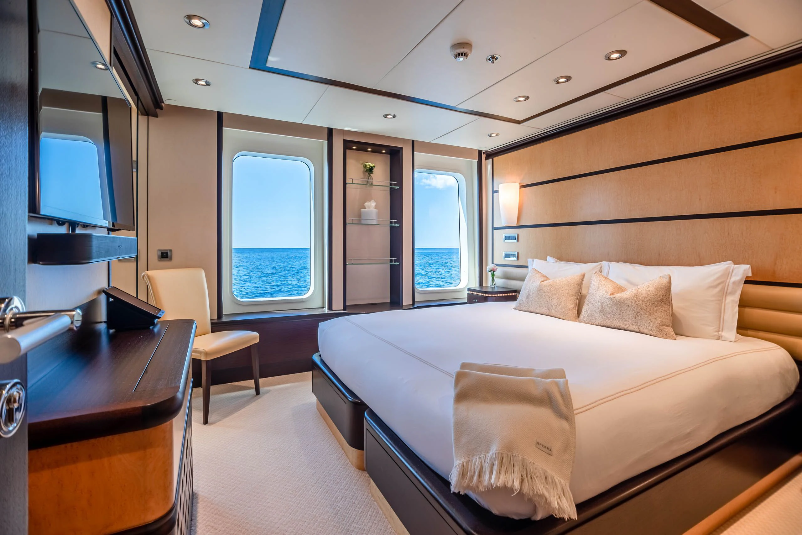 a room with a bed and a desk aboard HARLE Yacht for Sale