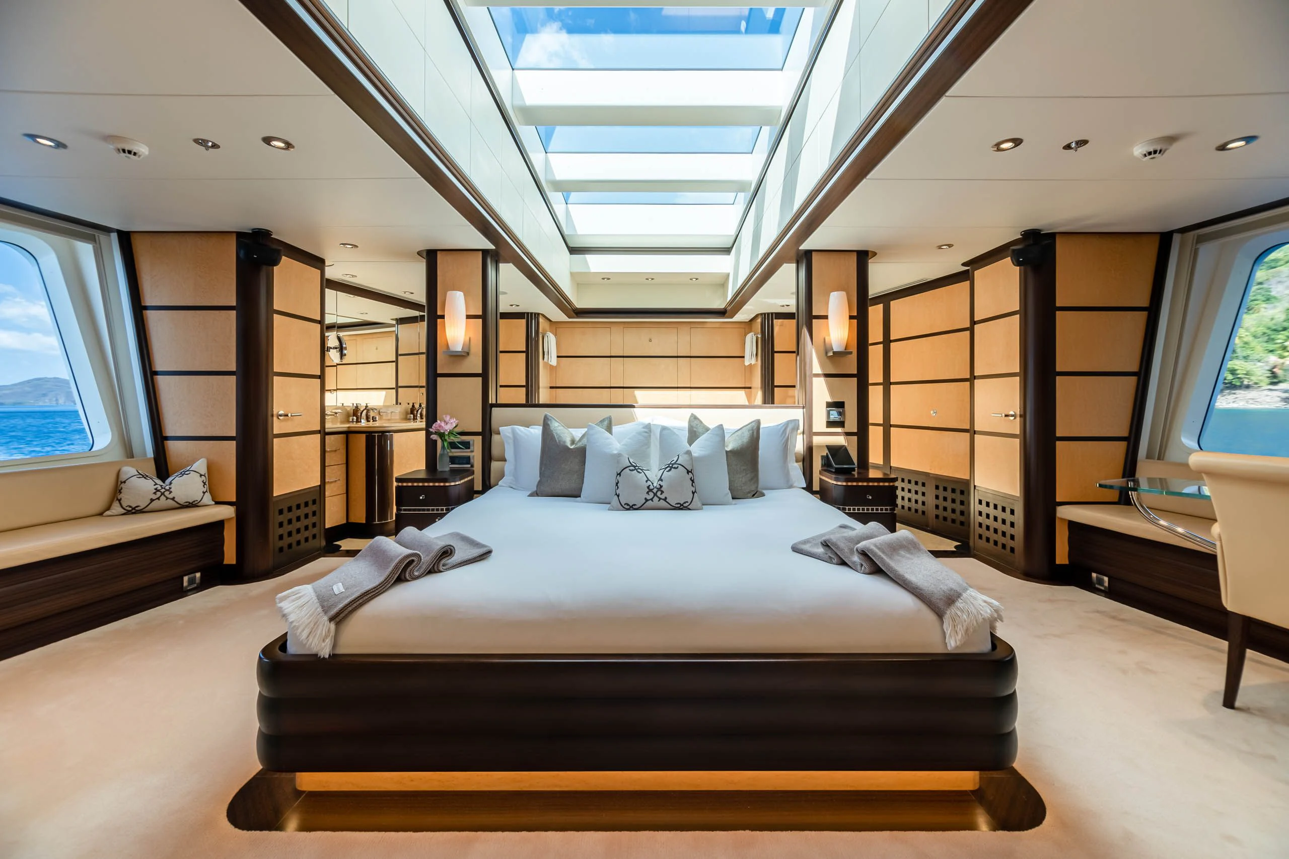 a large bedroom with a large bed aboard HARLE Yacht for Sale