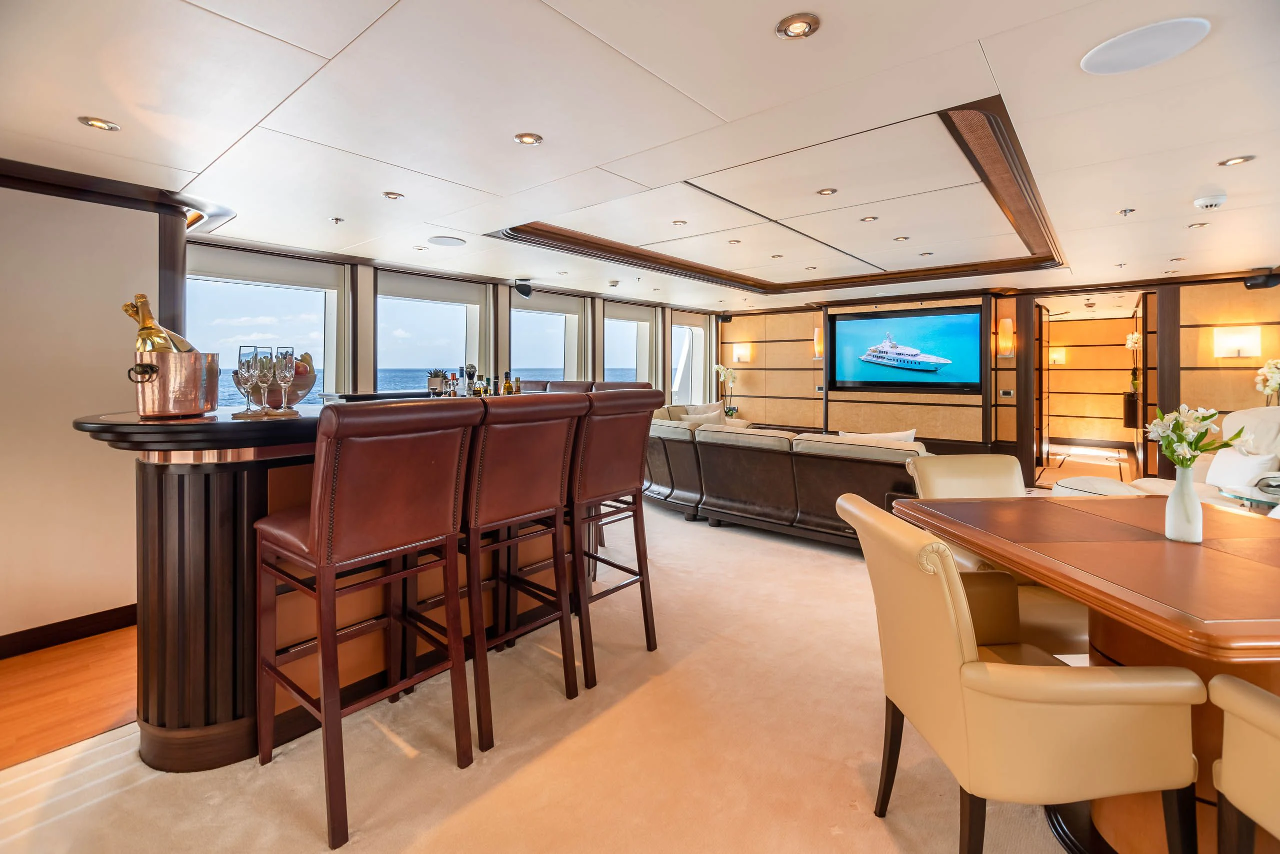 a room with a table and chairs aboard HARLE Yacht for Sale