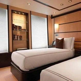 a room with a bed and a window aboard HARLE Yacht for Sale