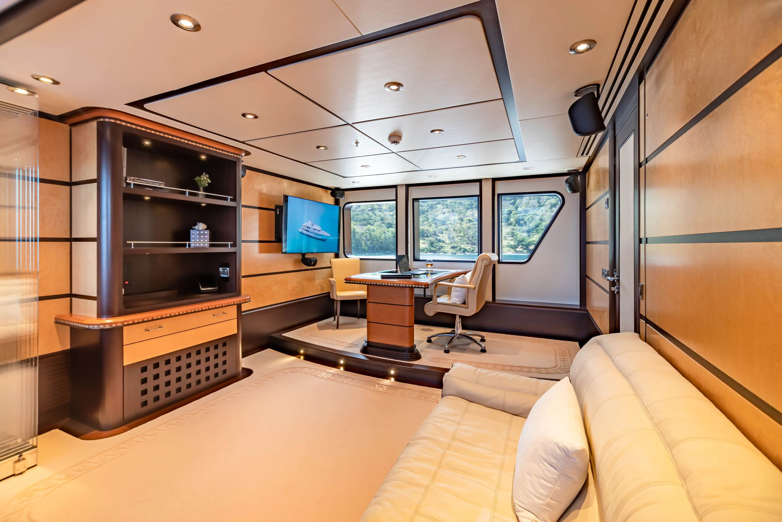 a living room with a large tv aboard HARLE Yacht for Sale
