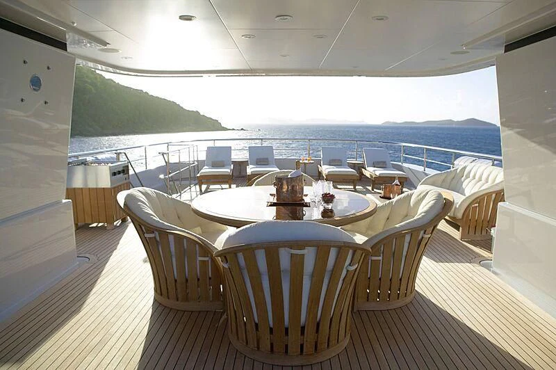 a room with a table and chairs aboard HARLE Yacht for Sale