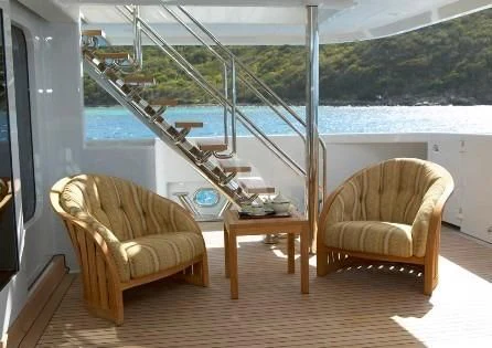 a room with chairs and a table aboard HARLE Yacht for Sale