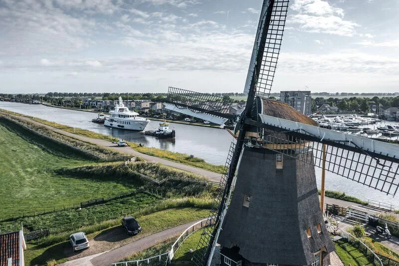 a large building with a tall tower aboard HARLE Yacht for Sale