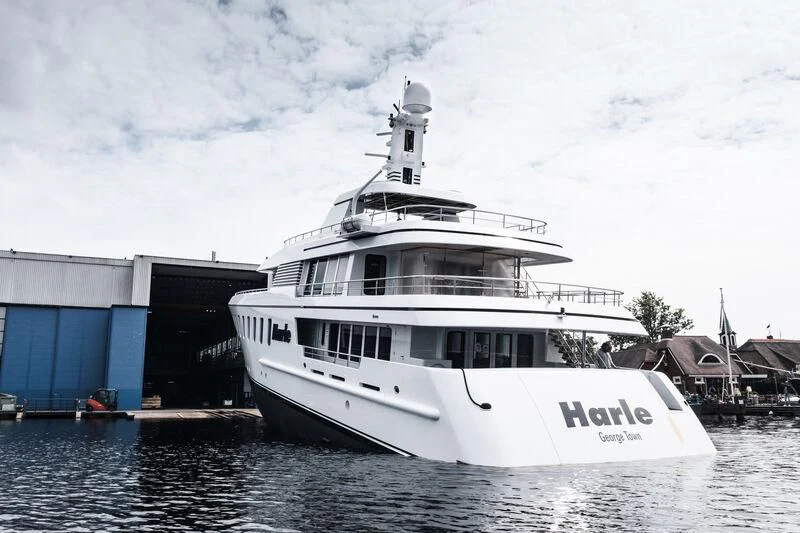 a large white boat in a harbor aboard HARLE Yacht for Sale