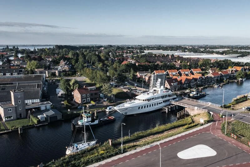 a large ship in a harbor aboard HARLE Yacht for Sale