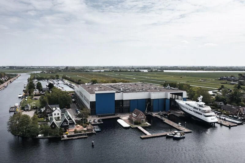 a large building with a dock in the middle of a body of water aboard HARLE Yacht for Sale