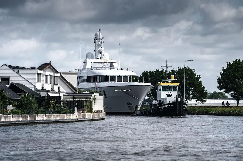 a large white boat on the water aboard HARLE Yacht for Sale