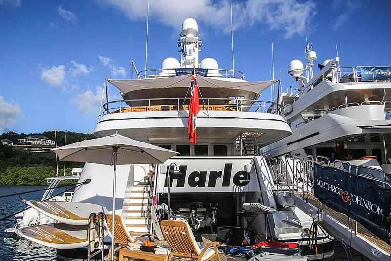 a large boat docked at a pier aboard HARLE Yacht for Sale