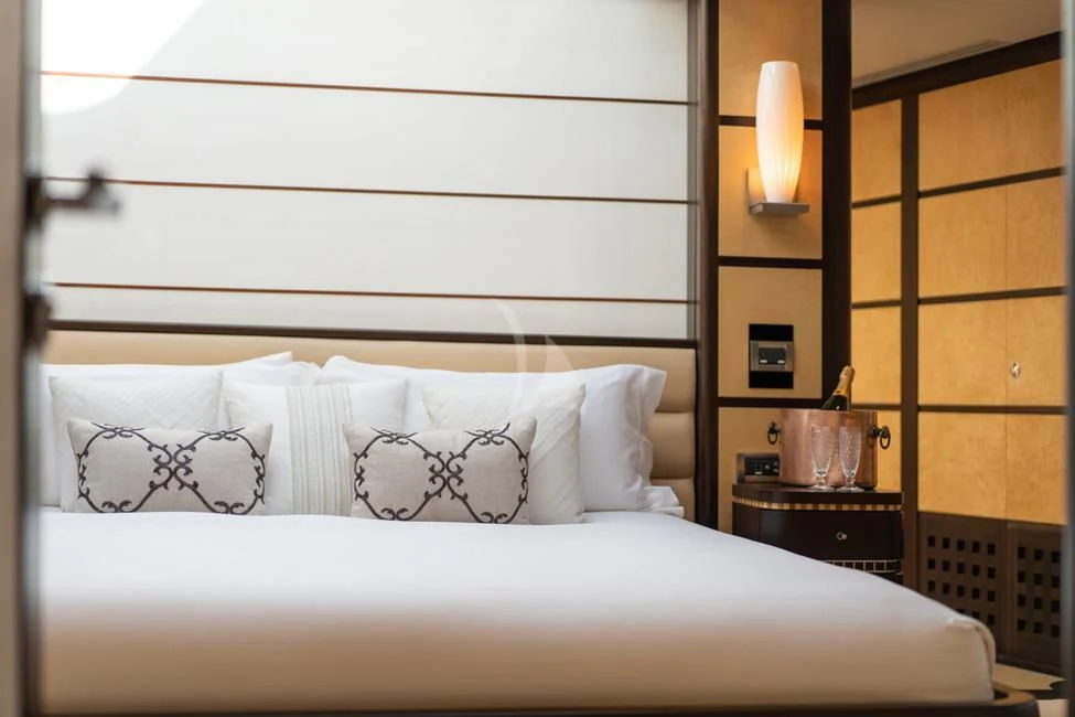 a bed with white sheets aboard HARLE Yacht for Sale