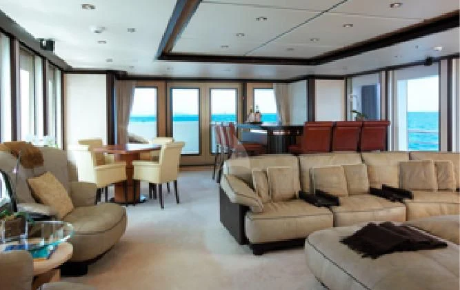 a living room with a couch and a table aboard HARLE Yacht for Sale
