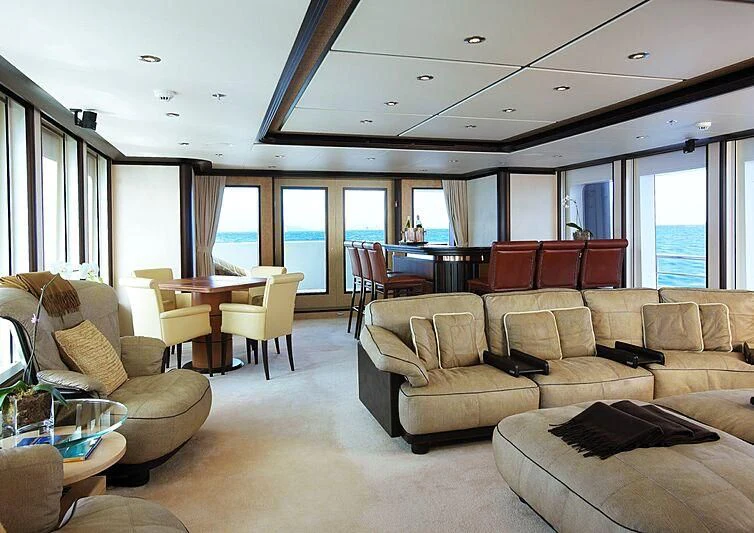a living room with a couch and a table aboard HARLE Yacht for Sale