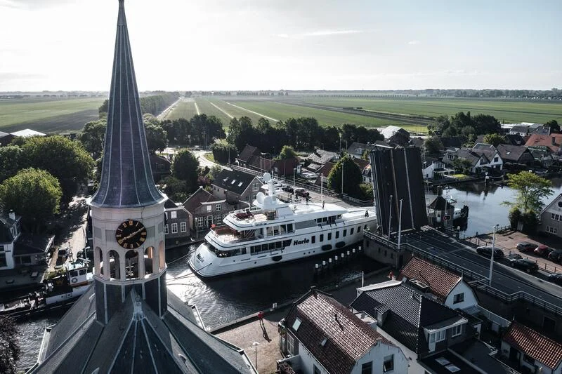 a large clock tower in a city aboard HARLE Yacht for Sale