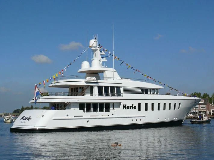 a large white boat on the water aboard HARLE Yacht for Sale
