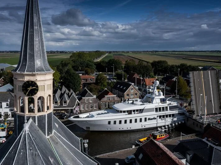 a large building with a clock tower aboard HARLE Yacht for Sale